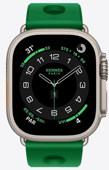 Apple Watch Hermès Ultra 4, หน้าปัดนาฬิกาอนาล็อก Circulaire, (เข็มชั่วโมง เข็มนาที และเข็มวินาที, กลไกหน้าปัด: สภาพอากาศ, วงแหวนกิจกรรม, เวลาปารีส และดัชนีรังสี UV), ตัวเรือนไทเทเนียม, สีธรรมชาติ, ภายนอกด้านขวา, Digital Crown, ปุ่มด้านข้างที่ยกสูงขึ้น, จับคู่กับสายแบบ Scub’H Diving, สี Vert Vertigo (เขียวสว่าง), วัสดุยางอัดขึ้นรูป, ช่องเจาะวงกลมตรงกลาง