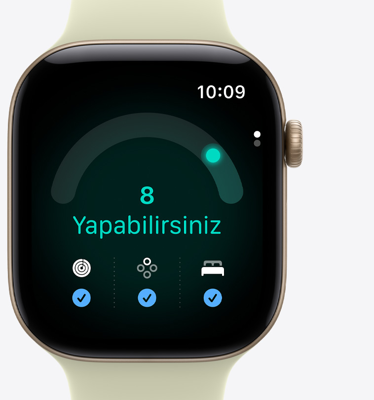 Apple Watch Series 12, alüminyum kasa, uçuk altın rengi, Hazır Olma uygulaması, hazır olma skoru 8, “yapabilirsiniz” mesajı, Aktivite halkaları, Yaşam Bulguları ve ekranın altında mavi tik işaretleriyle uyku skoru ölçümleri