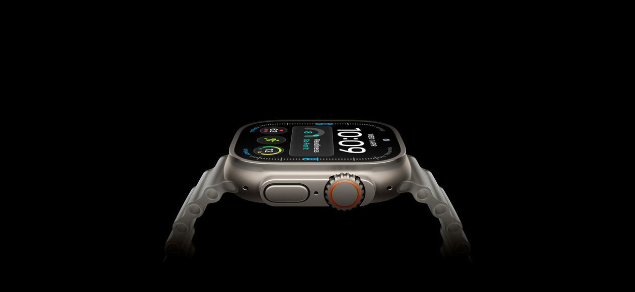 Apple Watch Ultra 4, titanium case, natural colour, right exterior, Digital Crown, raised side button, digital watch face, translucent grey Ocean Strap