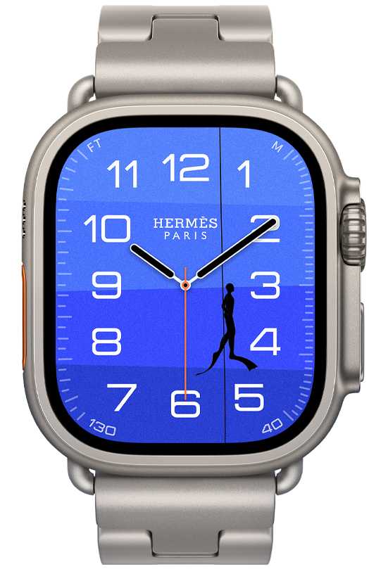 Apple Watch Hermès Ultra 4, Fathom and Wonder analog watch face (hour, minute, and second hands, Depth complication, with a diver swimming up through an ocean with a gradient from dark to light blue), titanium case, natural color, right side exterior, Digital Crown, raised side button, paired with Grand H Titane band, Gris Titane color, background is an underwater scene with an orange buoy floating on top of a blue ocean that darkens towards the seafloor, with two light blue seahorses guarding an orange Hermès box on the seafloor